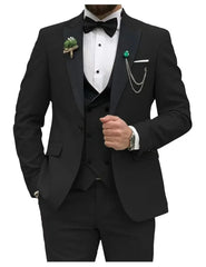 A slim fit black three-piece tuxedo suit featuring a peak lapel, bow tie, and decorative chain.