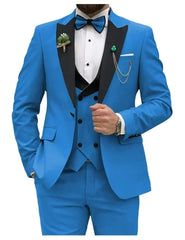 A slim fit bright blue three-piece tuxedo with a black peak lapel, bow tie, and vest.