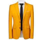A slim fit yellow single-breasted blazer with a notch lapel worn with a white shirt and dark tie.