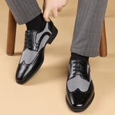 Men's black and white plaid lace-up business shoes with a square toe and rubber sole.
