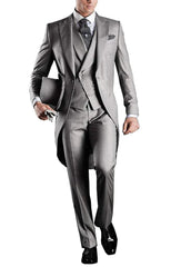 A man wears a grey three-piece tailcoat suit with a vest, trousers, and a top hat.
