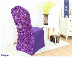 A purple spandex chair cover featuring a textured rose embroidered back panel.