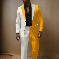 A man wears a two-piece suit featuring a split-color design of white and yellow with a black shirt.