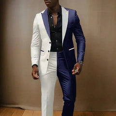 A man wears a two-piece suit featuring a split-color design in white and navy blue.