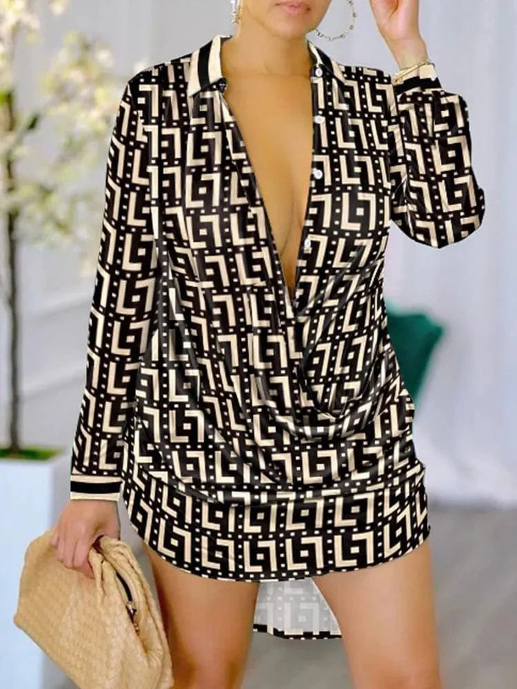 A woman wears a long-sleeve mini shirt dress featuring a black and beige geometric letter print.