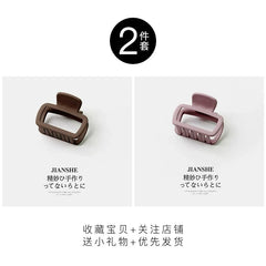Two square matte hair claw clips in brown and dusty pink colors.