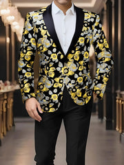 A man wears a black blazer featuring a yellow and silver floral pattern with a notched lapel.