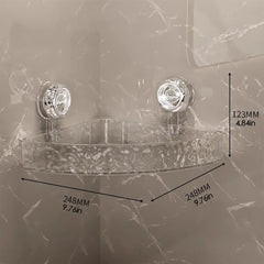 A clear, triangular corner shower shelf with two suction cup mounts and dimension labels.