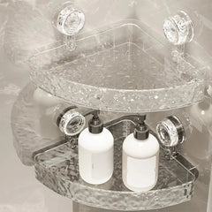 Two clear, textured plastic corner shelves mounted to a wall with suction cups.