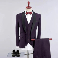 A dark purple three-piece suit with a black shawl collar, white shirt, and patterned bow tie.
