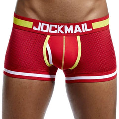 A pair of red mesh nylon boxer briefs with a yellow waistband featuring the JOCKMAIL logo.