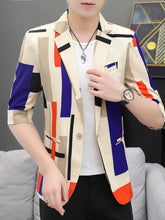 A man wears a slim-fit, half-sleeve casual blazer featuring a colorful geometric pattern.