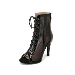 Black patent leather peep-toe stiletto booties featuring a lace-up front and mesh side panels.