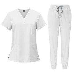 A white V-neck scrub top and matching jogger pants with a drawstring waist.