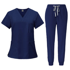 A navy blue V-neck scrub top and matching jogger pants with a drawstring waist.