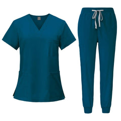A teal V-neck scrub top and matching jogger-style pants with a drawstring waist.