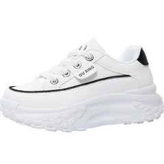 A white platform sneaker with black trim and the text OU XING on the side.