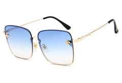 Oversized square rimless sunglasses for women featuring blue gradient lenses and small bee accents.