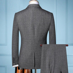 A grey slim-fit men's suit jacket and matching trousers shown from the back.