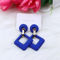 A pair of blue geometric hollow square acrylic dangle earrings with gold-tone metal accents.