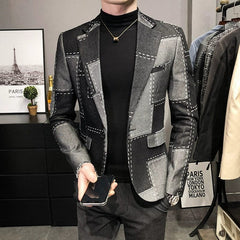 A slim-fit, single-breasted wool suit jacket featuring a grey and black color-block pattern.