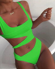 A neon green one-piece swimsuit featuring a scoop neckline, cut-out midriff, and spaghetti straps.