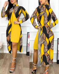 A woman wears a yellow knee-length dress paired with a long-sleeved, printed split cardigan.