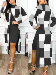 A woman wears a black knee-length dress paired with a long-sleeved, checkered print cardigan.