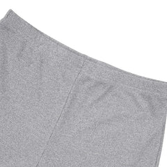 A close-up view of the grey ribbed knit fabric on the elastic waistband of the shorts.