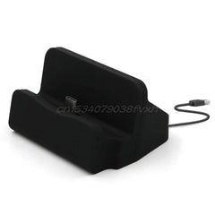 A black USB-C desktop charging dock with an integrated cable for smartphones.