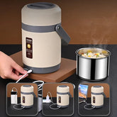 A portable USB-powered electric lunch box with a stainless steel interior for heating food.