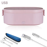 A pink USB heated electric lunch box with a set of metal cutlery and a charging cable.