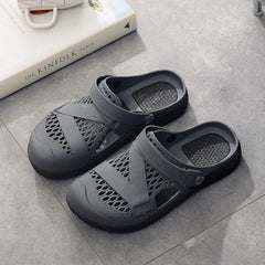A pair of grey rubber backstrap sandals with a breathable mesh design and thick soles.
