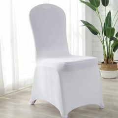 A white, stretchable spandex chair cover fitted over a dining chair.