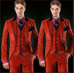 A three-piece red velvet suit for men featuring a slim fit, black lapels, and a patterned shirt.
