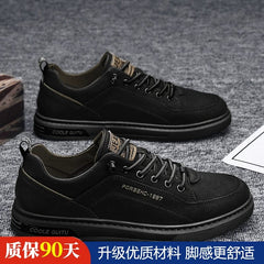 A pair of black casual men's sneakers with lace-up closures and rubber soles.