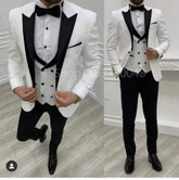 A three-piece white tuxedo suit with a black peak lapel, vest, and trousers.