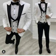 A three-piece white tuxedo suit with a black peak lapel, vest, and trousers.
