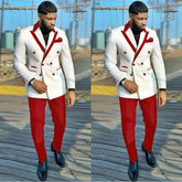 A man wears a white double-breasted suit jacket with red peaked lapels and matching red trousers.