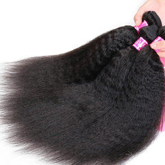 A hand holds several bundles of black kinky straight human hair extensions.