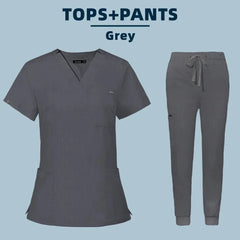 A grey women's scrub set featuring a V-neck top and jogger-style pants with a drawstring waist.