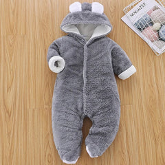 A gray, long-sleeved, hooded baby romper made of soft, fuzzy material with white ear accents.