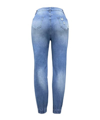 Back view of light blue denim ankle-length pencil pants with distressed details and pockets.