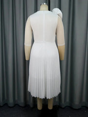Back view of a white knee-length A-line dress with half sleeves and a pleated skirt.