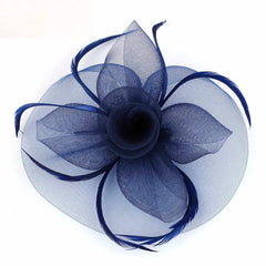 A navy blue mesh fascinator hat featuring a central flower design accented with delicate feathers.