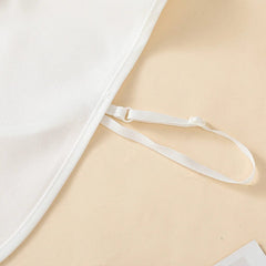 A white chiffon fake collar featuring a black wavy embroidered edge and an adjustable strap.