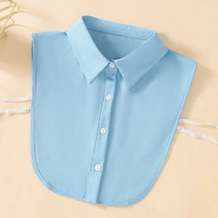 A light blue detachable shirt collar with a button-down front and adjustable side straps.