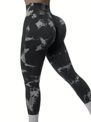 A woman wears black and white tie-dye high-waisted seamless yoga leggings.
