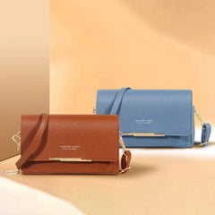 Two rectangular shoulder bags in brown and blue with gold-tone hardware on a beige background.