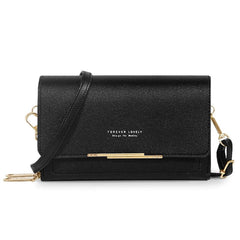 A black rectangular shoulder bag with a gold metal accent and a detachable strap.
